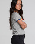 Back view of a woman wearing the Chaser California Dreamin Tee and black pants on a neutral background