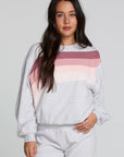 Front view of a woman wearing the Chaser  Cashbah Heather Grey Pullover on a neutral background