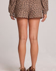 Back view of a woman wearing the Chaser  Clary Leopard Ribbed Shorts on a neutral background
