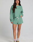 Back view of a woman wearing the Chaser Clary Verdelle Relaxed Shorts matching set on a neutral background