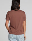 Back view of a woman wearing the Chaser Cute Buttired Top on a neutral background with pants