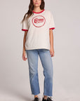 A full body front view of a woman wearing the Chaser David Bowie Bowie Bolt Tee on a neutral background