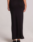 Back view of a woman wearing the Chaser  Eloyse Black Maxi Skirt on a neutral background