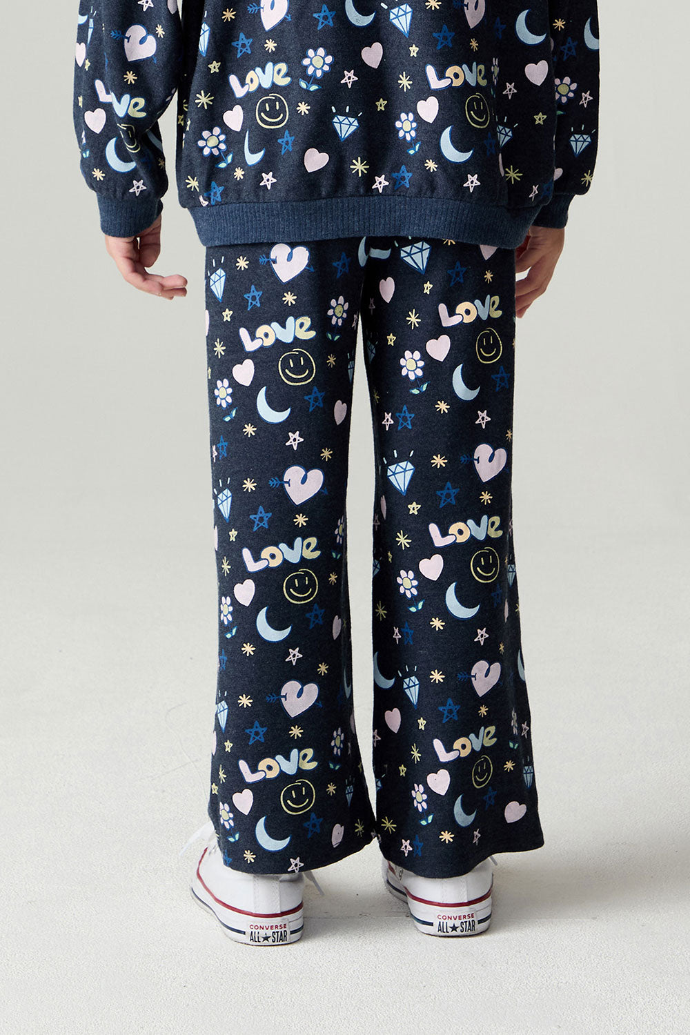 Back view of a girl wearing the Chaser Free Draw Pants Girls Jogger on a neutral background