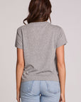 Back view of a woman wearing the Chaser Game Days Graphic Tee and jeans on a neutral background with arms lowered