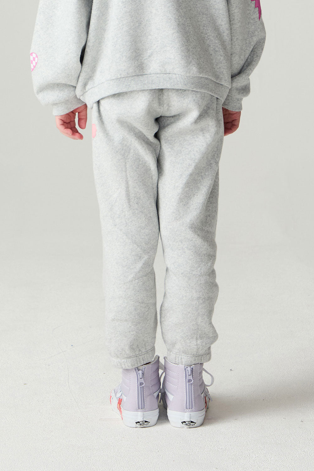 Back view of a girl wearing the Chaser Girl Power Medley Pants Girls Jogger on a neutral background