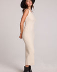 Side view of a woman wearing the Chaser   Gracelyn Antique White Dress on a neutral background with hat