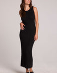 Front view of a woman wearing the Chaser  Gracelyn Black Dress on a neutral background with black shoes
