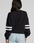 Back view of a woman wearing the Chaser I Love Sports Sweatshirt on a neutral background with jeans