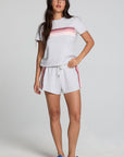 Full body front view of a woman wearing the Chaser Isla Light Heather Grey Tee and matching grey shorts on a neutral background