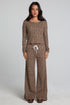 Full body front view of a woman wearing the Chaser  Jorgia Leopard Pant on a neutral background with matching top