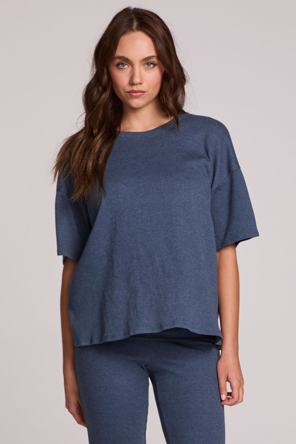 Front view of a woman wearing the Chaser Lunnah Dark Denim Top on a neutral background 