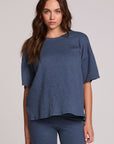 Front view of a woman wearing the Chaser Lunnah Dark Denim Top on a neutral background 
