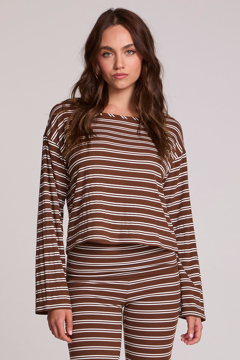 Front view of a woman wearing the Chaser Lunnah Nutty Brown Top on a neutral background 