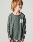 Front view of a boy wearing the Chaser Monster Truck Boys Tee and matching set on a neutral background