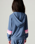 Back view of a girl wearing the Chaser Multi Stripes Girls Hoodie on a neutral background