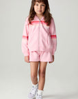 A full body front view of a girl wearing the Chaser Multi Stripes Girls Zip Up on a neutral background