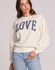 Front view of a woman wearing the Chaser Navy Love Pullover Sweater on a neutral background 
