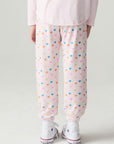 Back view of a girl wearing the Chaser Party Hearts Girls Jogger on a neutral background