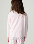 Back view of a girl wearing the Chaser Party Hearts Girls Tee on a neutral background