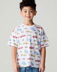 Front view of a boy wearing the Chaser Race Day Boys Tee on a neutral background with bluejeans