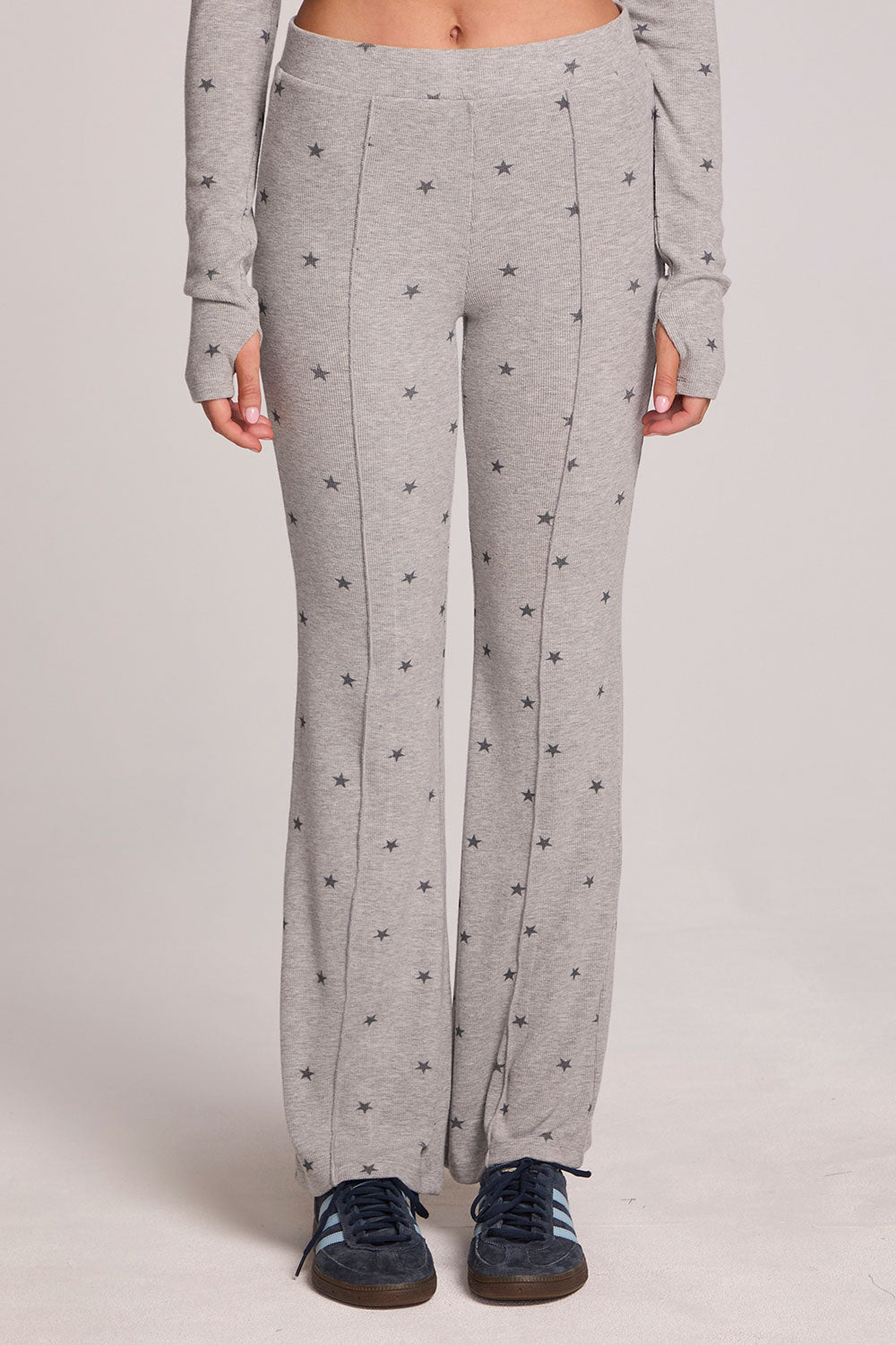 Front view of a woman wearing the Chaser Rhose Light Heather Grey Pants on a neutral background with arms down