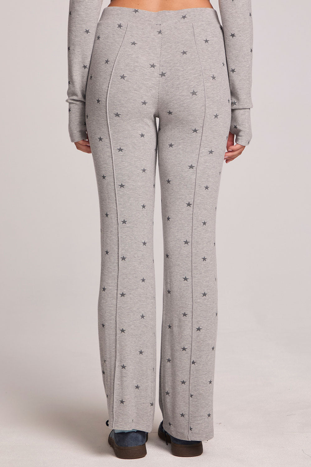 Back view of a woman wearing the Chaser Rhose Light Heather Grey Pants on a neutral background with arms at sides