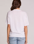 Back view of a woman wearing the Chaser Rodeo Show Tee on a neutral background with jeans