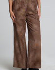 Front view of a woman wearing the Chaser Seren Choco Check Pants on a neutral background
