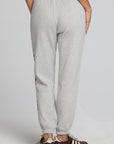 Back view of a woman wearing the Chaser  Shocking Bolt Pants on a neutral background
