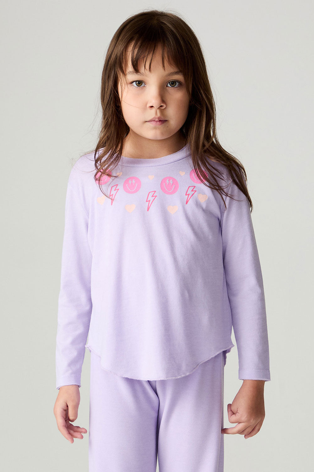 Front view of a girl wearing the Chaser Shocking Love Girls Tee on a neutral background with matching purple shirt