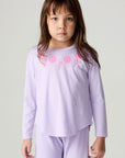 Front view of a girl wearing the Chaser Shocking Love Girls Tee on a neutral background with matching purple shirt