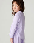 Back view of a girl  wearing the Chaser Shocking Love Girls Tee on a neutral background with matching shirt