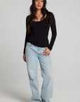 Full body front view of a woman wearing the Chaser Silva Black Fullsleeve Top on a neutral background
