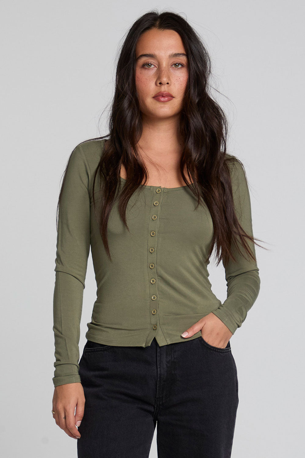 Front view of a woman wearing the Chaser Silva Forager Green Fullsleeve Top on a neutral background