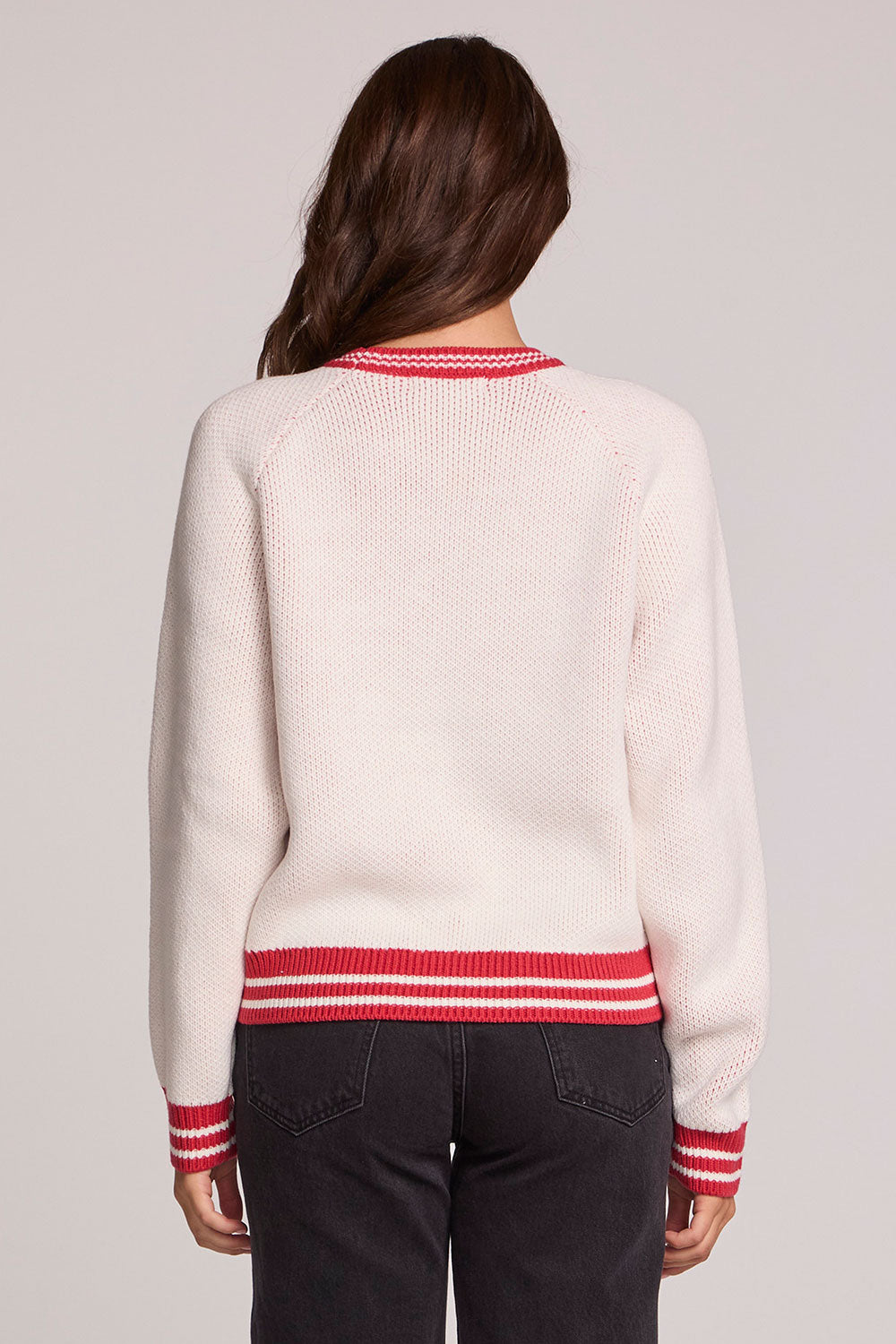 Back view of a woman wearing the Chaser Ski Longsleeve on a neutral background with arms at sides