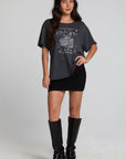 A full body front view of a woman wearing the Chaser Socal Motorcycles Tee on a neutral background