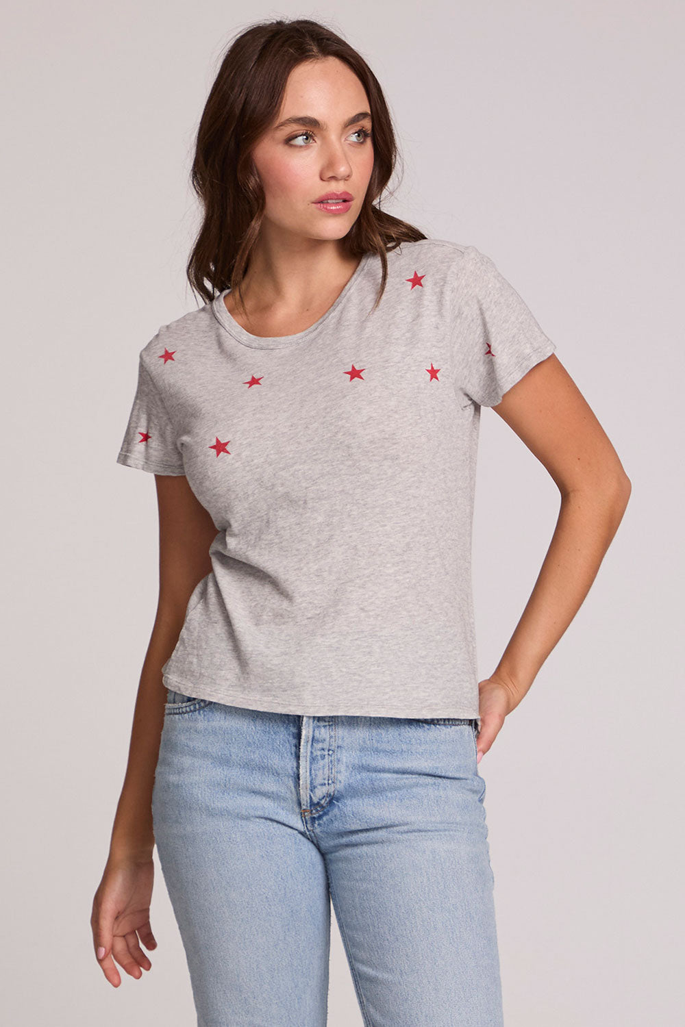 Front view of a woman wearing the Chaser Star Setter Cropped Tee on a neutral background