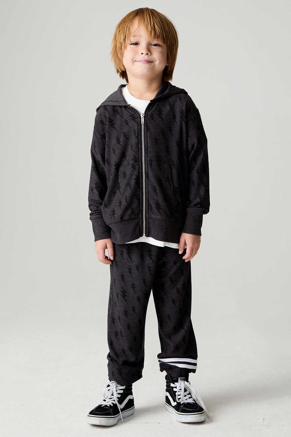 A full body front view of a boy wearing the Chaser Storm Boys Hoodie on a neutral background