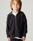 Front view of a boy wearing the Chaser Storm Boys Hoodie on a neutral background with matching lounge pants