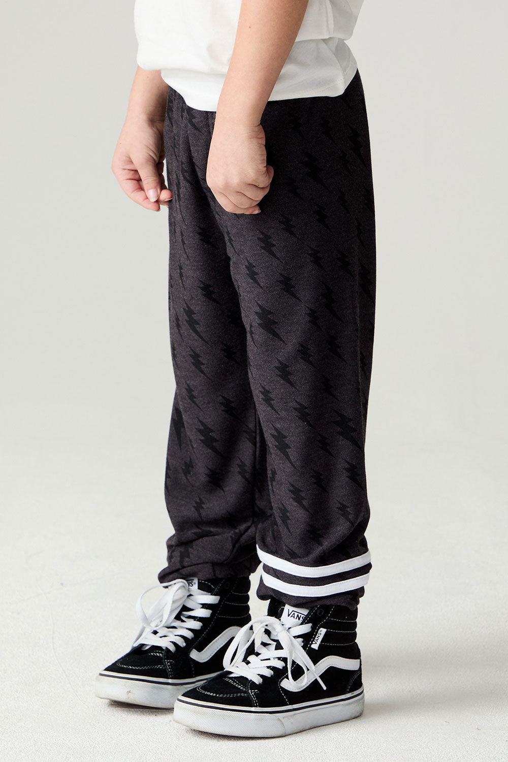 Side view of a boy wearing the Chaser Storm Boys Jogger on a neutral background
