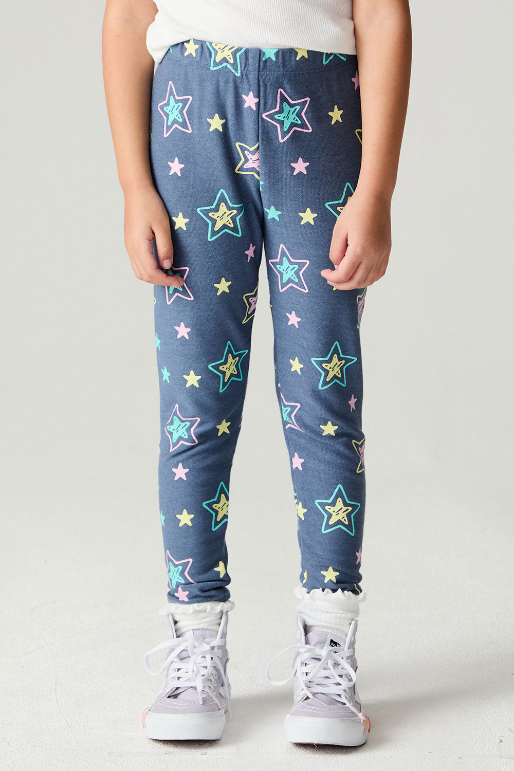 Front view of a girl wearing the Chaser Super Star Girls Joggers on a neutral background with white shirt and arms at sides