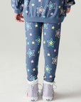Back view of a girl wearing the Chaser Super Star Girls Joggers on a neutral background