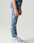 Side view of a girl wearing the Chaser Super Star Girls Joggers on a neutral background with arms at sides