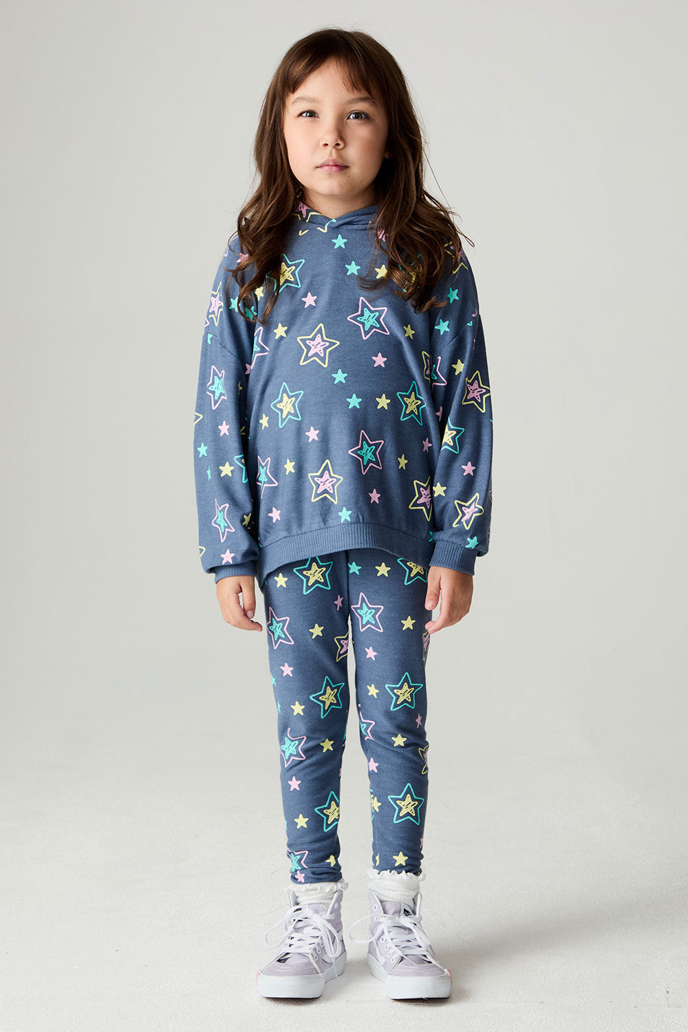 A full body front view of a girl wearing the Chaser Super Star Girls Zip Up on a neutral background