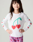Front view of a girl wearing the Chaser Sweethearts Girls Tee on a neutral background with matching pink pants