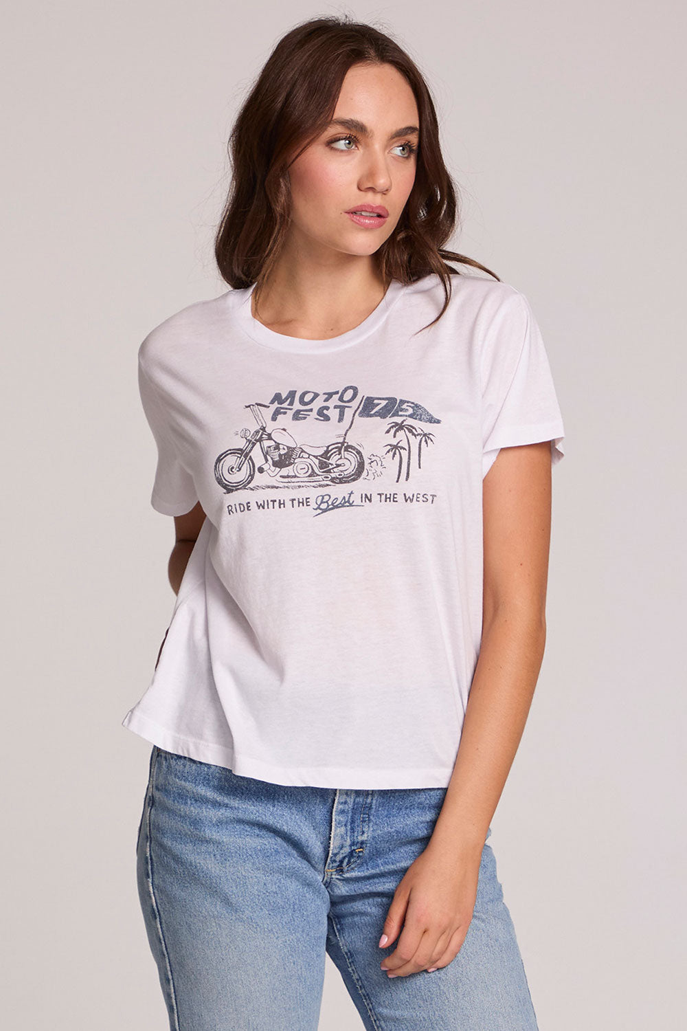 Front view of a woman wearing the Chaser  The Best Cropped Graphic Tee on a neutral background