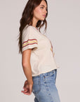 Side view of a woman wearing the Chaser  The Rolling Stones Retro Tongue Tee on a neutral background