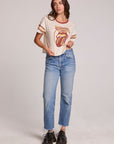 Full body front view of a woman wearing the Chaser  The Rolling Stones Retro Tongue Tee on a neutral background with jeans and hands on hips