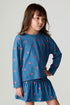 Front view of a girl wearing the Chaser Tiny Hearts Girls Tee on a neutral background with arms at sides
